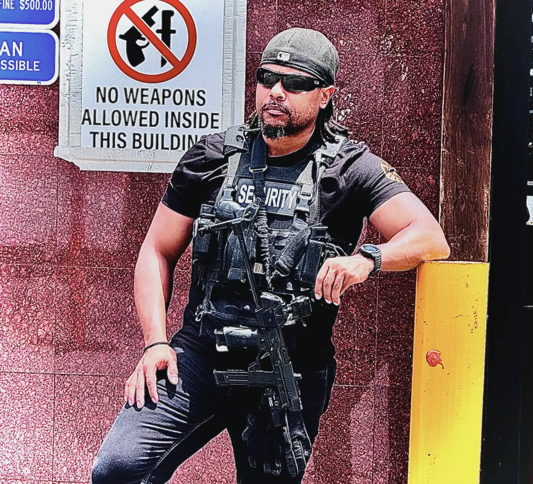 Armed Kinetic Protection Group officer on post at a commercial property